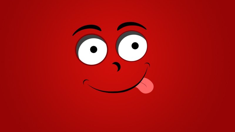 Красный смайлик с улыбкой на черном фоне