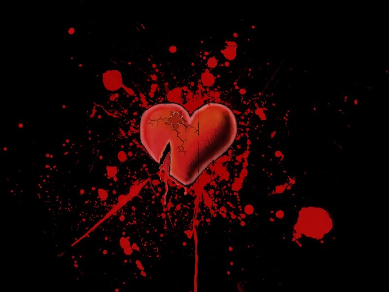 Красное разбитое сердце на черном фоне